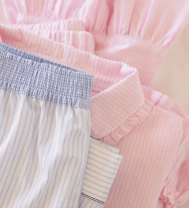 Placeholder for a close-up photograph of soft fabric, garment seams and sample details.